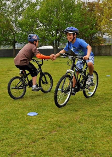 Children at Westbook Primary (Rotorua) play a game as part of the BikeNZ Learn to Ride Program